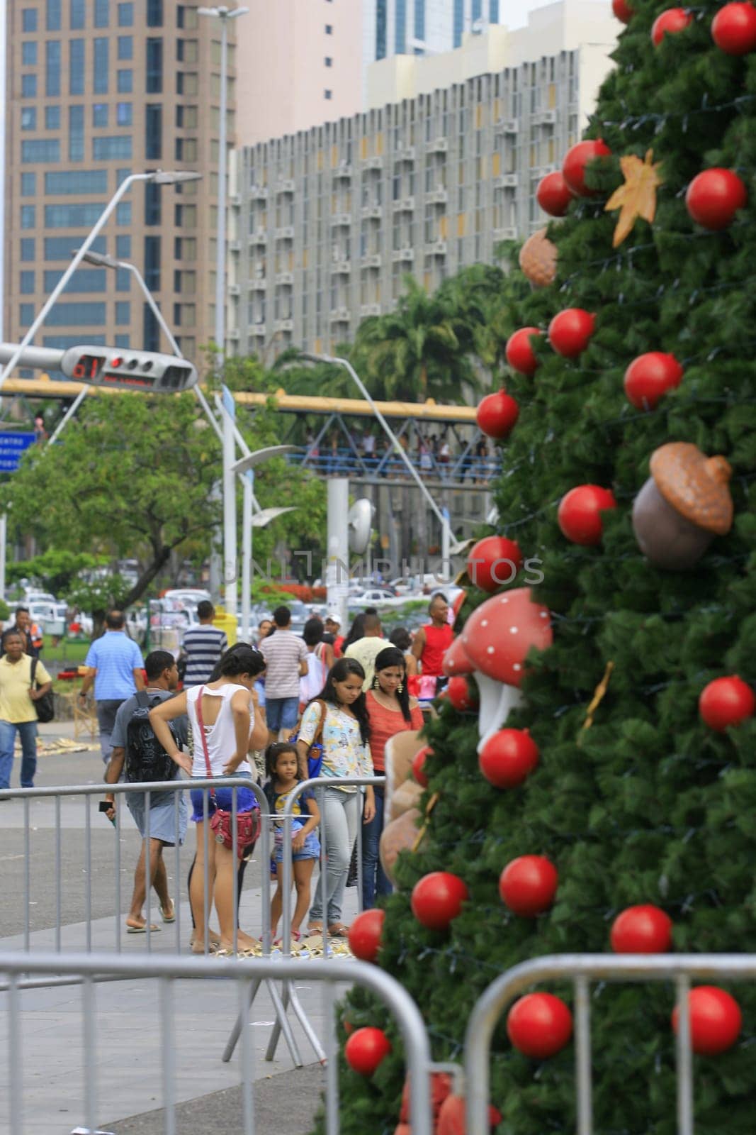 salvador, bahia / brazil - december 19, 2013: People are seen near the Christmas tree in Nilton Rique Square, facing the Iguatemi Shopping Mall in Salvador.