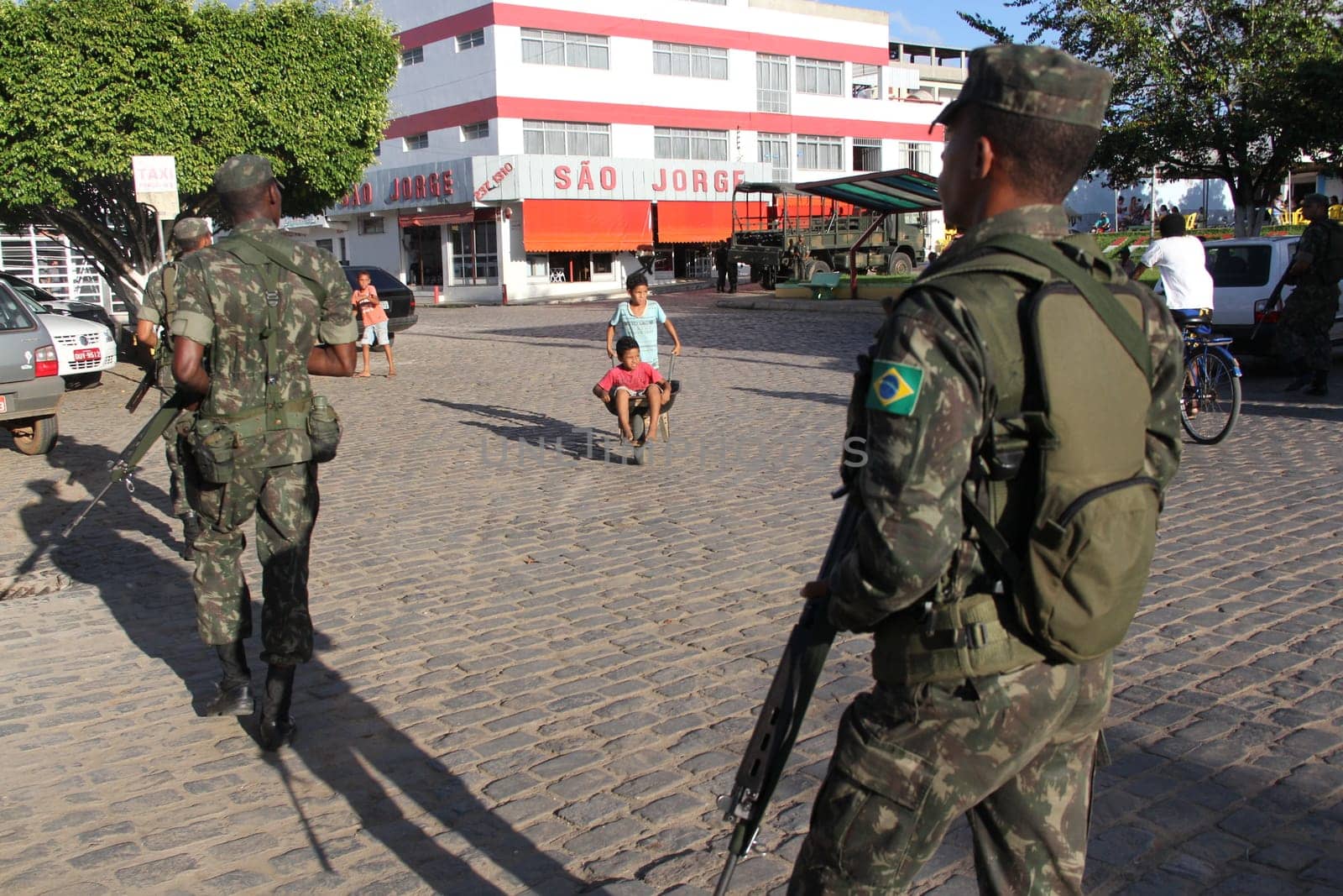 buerarema, bahia / brazil - february 14, 2014: Army soldiers patrol the streets of Buerarema City Center due to series of conflicts involving Tupinamba ethnic Indians and local farmers..