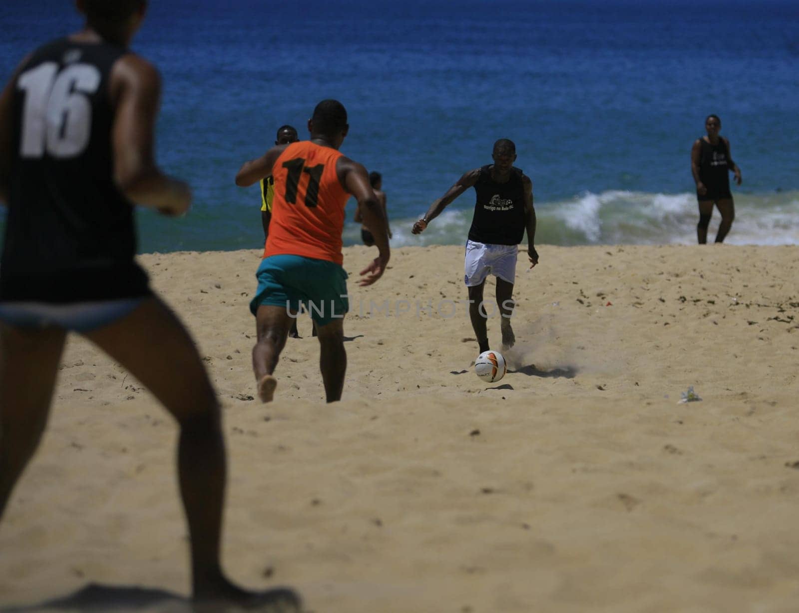 salvador, bahia / brazil - december 29, 2013: People are seen playing soccer on Amaralina beach in the city of Salvador.