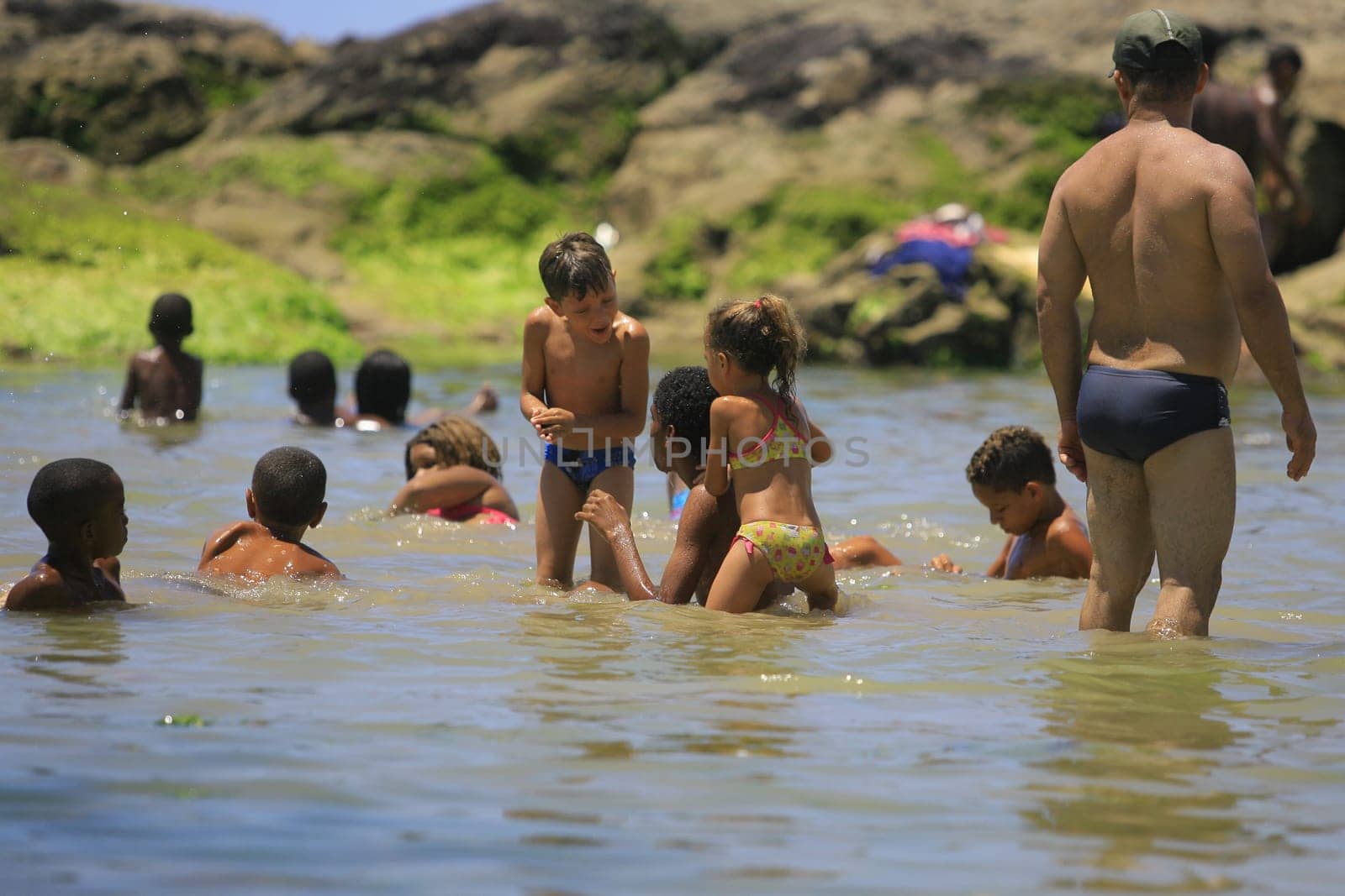salvador, bahia / brazil - January 1, 2014: People are seen at Itapua Beach in the city of Salvador.
