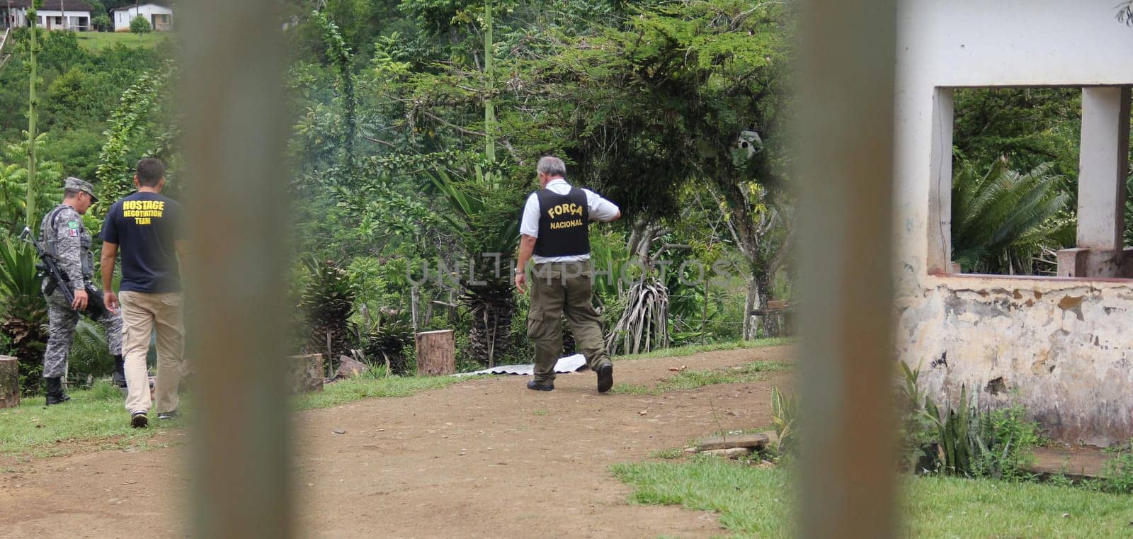 ilheus, bahia / brazil - february 15, 2014: National Force agents survey armed conflict area between farmers and Tupinamba Indians in rural Ilheus.