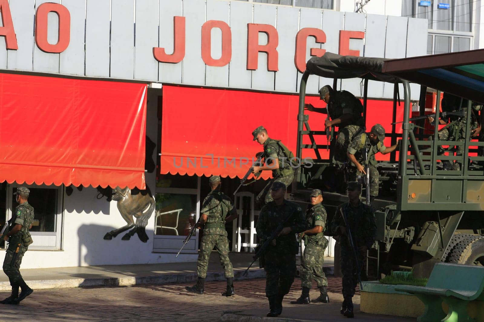 buerarema, bahia / brazil - february 14, 2014: Army soldiers patrol the streets of Buerarema City Center due to series of conflicts involving Tupinamba ethnic Indians and local farmers..