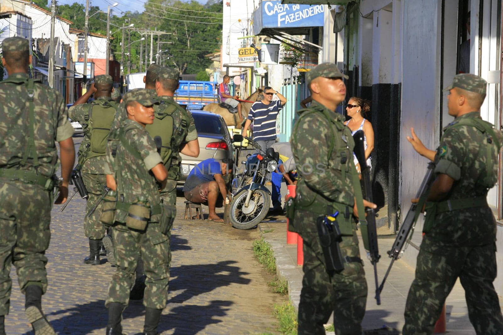 buerarema, bahia / brazil - february 14, 2014: Army soldiers patrol the streets of Buerarema City Center due to series of conflicts involving Tupinamba ethnic Indians and local farmers..