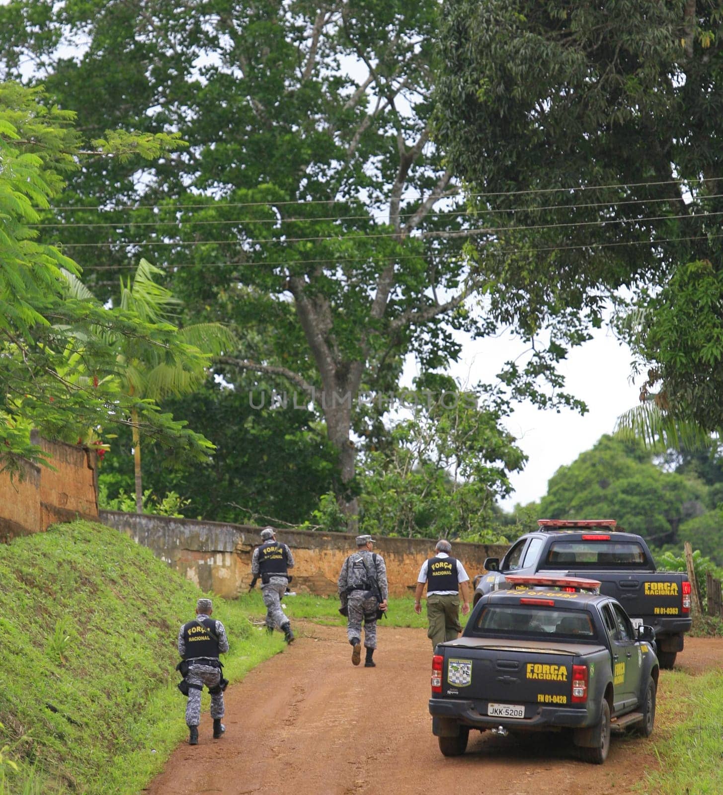 ilheus, bahia / brazil - february 15, 2014: National Force agents survey armed conflict area between farmers and Tupinamba Indians in rural Ilheus.