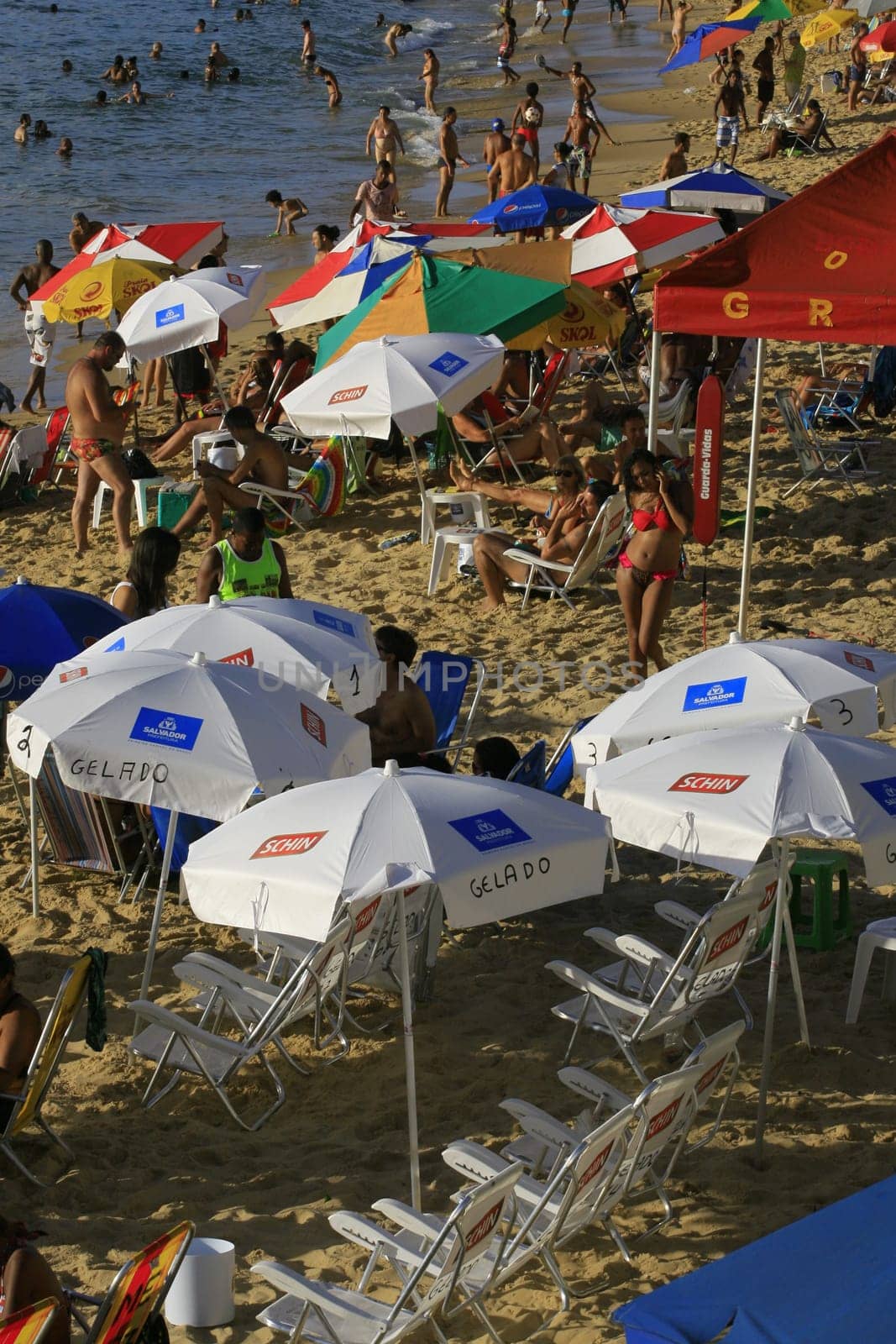 salvador, bahia / brazil - april 22, 2014: People are seen at Porto da Barra beach in Salvador city.