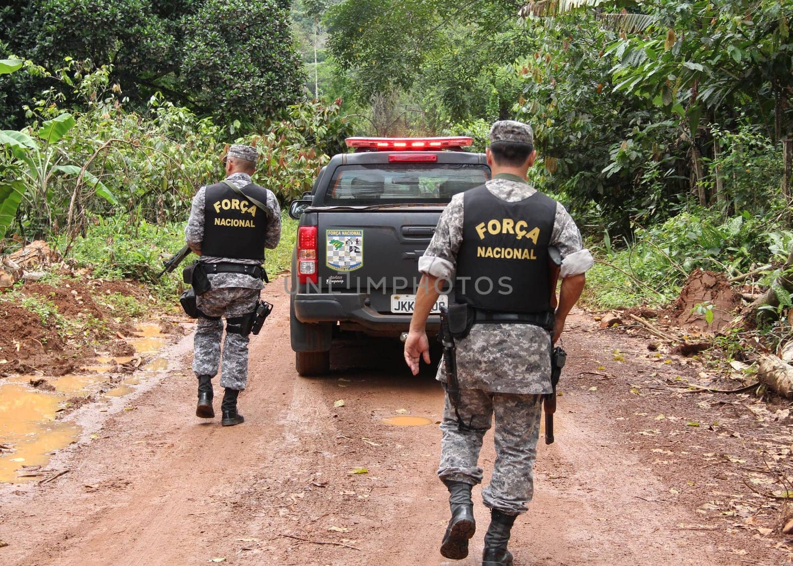 ilheus, bahia / brazil - february 15, 2014: National Force agents survey armed conflict area between farmers and Tupinamba Indians in rural Ilheus.