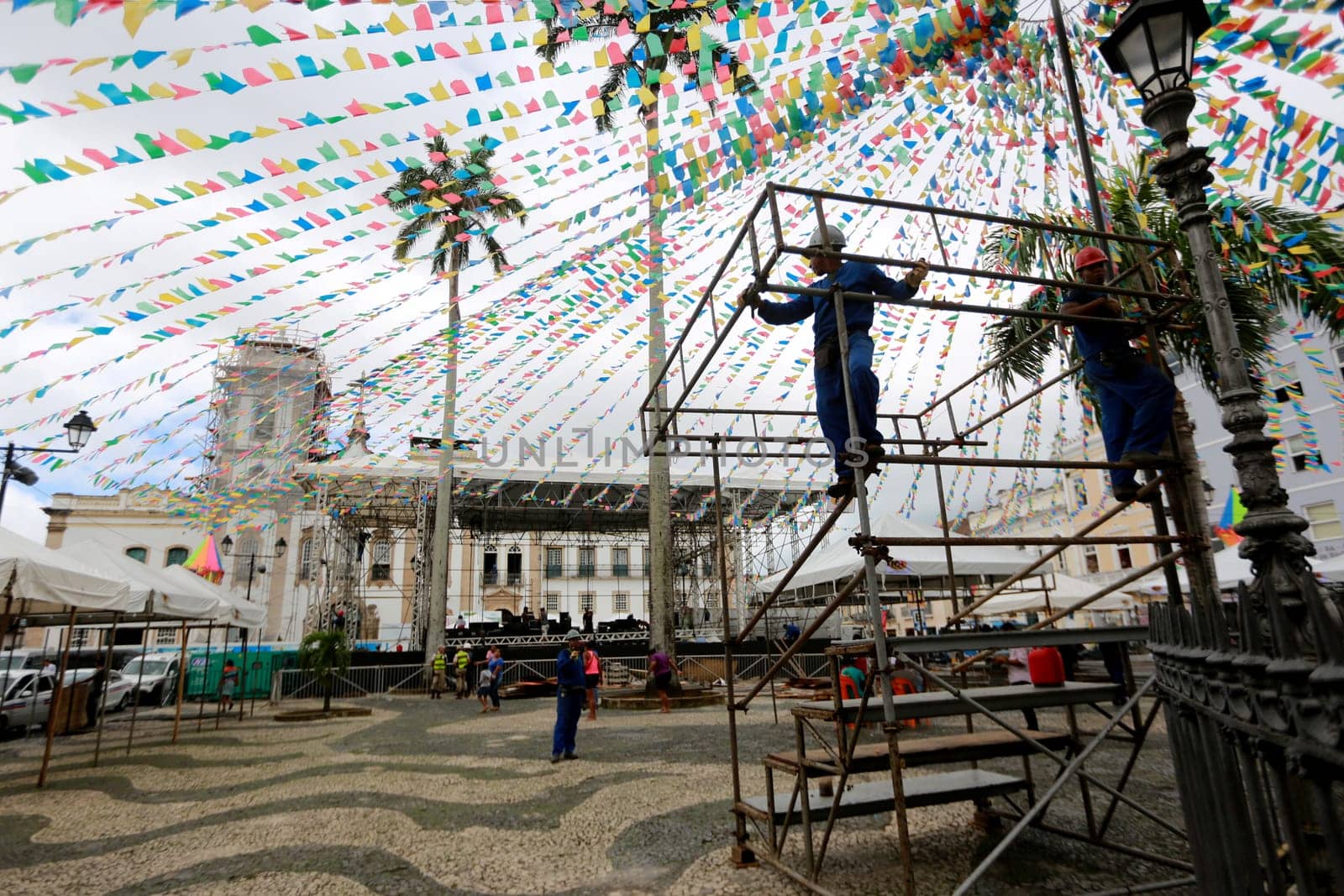 salvador, bahia / brazil - june 19, 2015: Workers are seen working on setting up a stage structure in Pelourinho for the Sao Joao festivities in the city of Salvador....