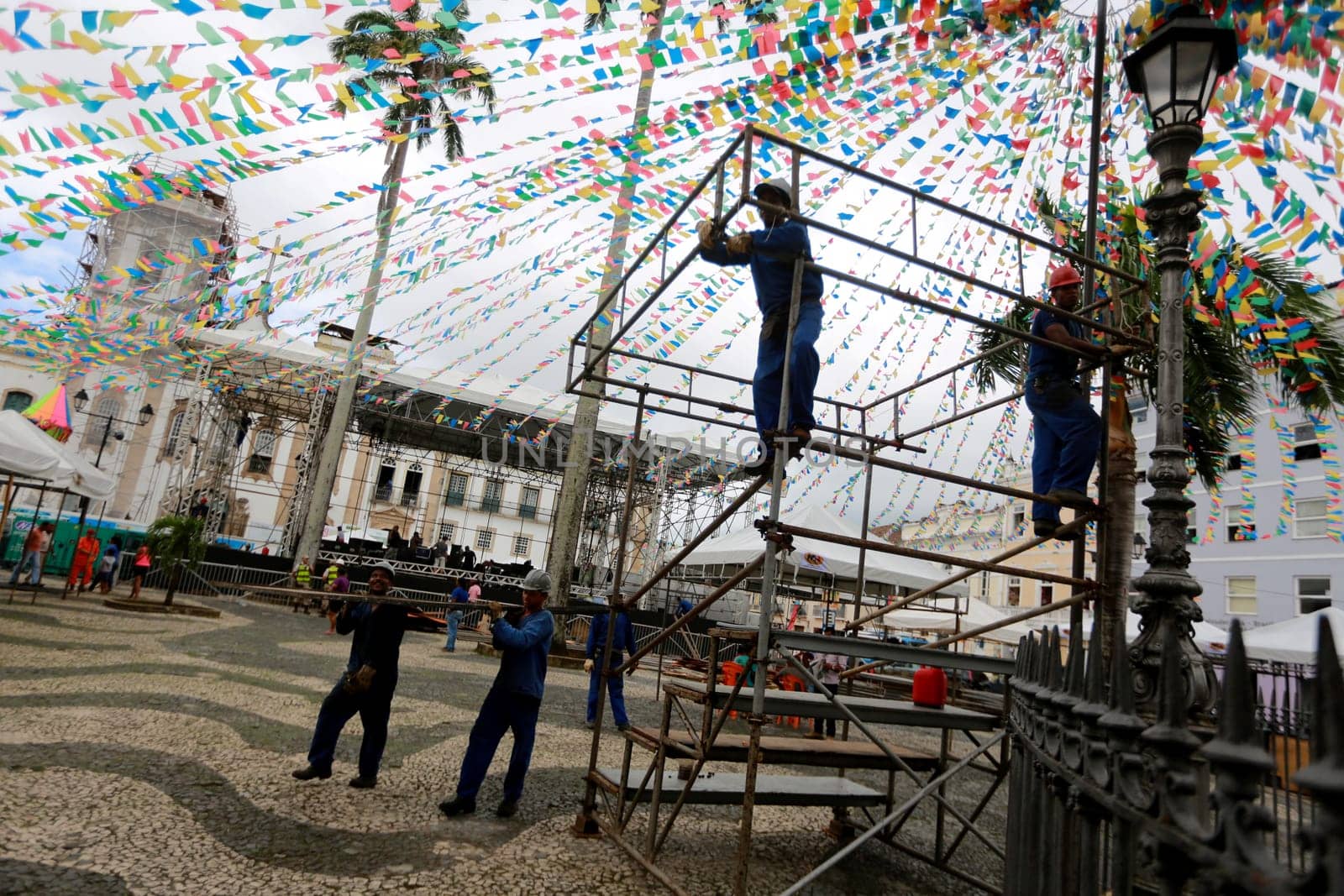 salvador, bahia / brazil - june 19, 2015: Workers are seen working on setting up a stage structure in Pelourinho for the Sao Joao festivities in the city of Salvador....