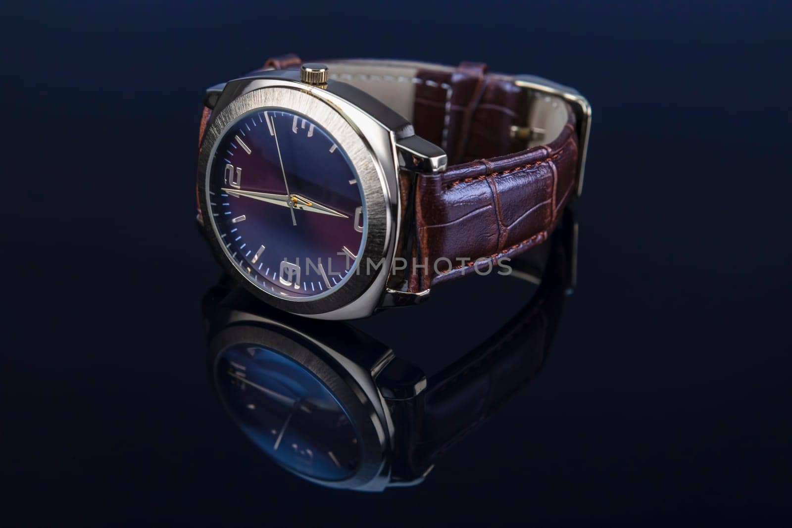 Men wrist watch with leather bracelet on black glossy background.
