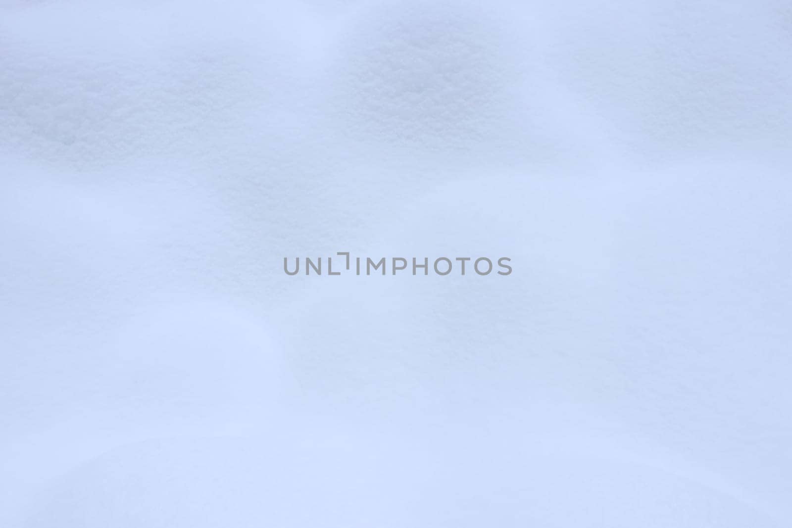 Winter snowdrift landscape background. Soft snow hills surface. Snowy mound texture.