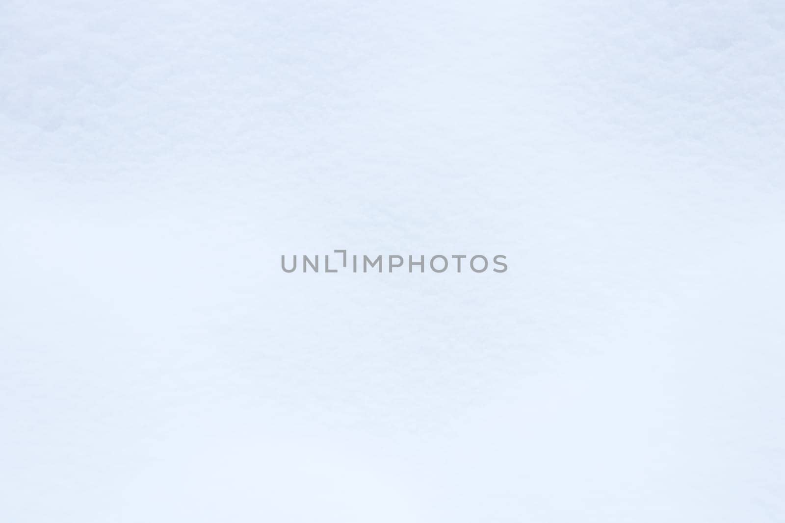 Snowy mound texture. Winter snowdrift landscape background. Soft snow hills surface.