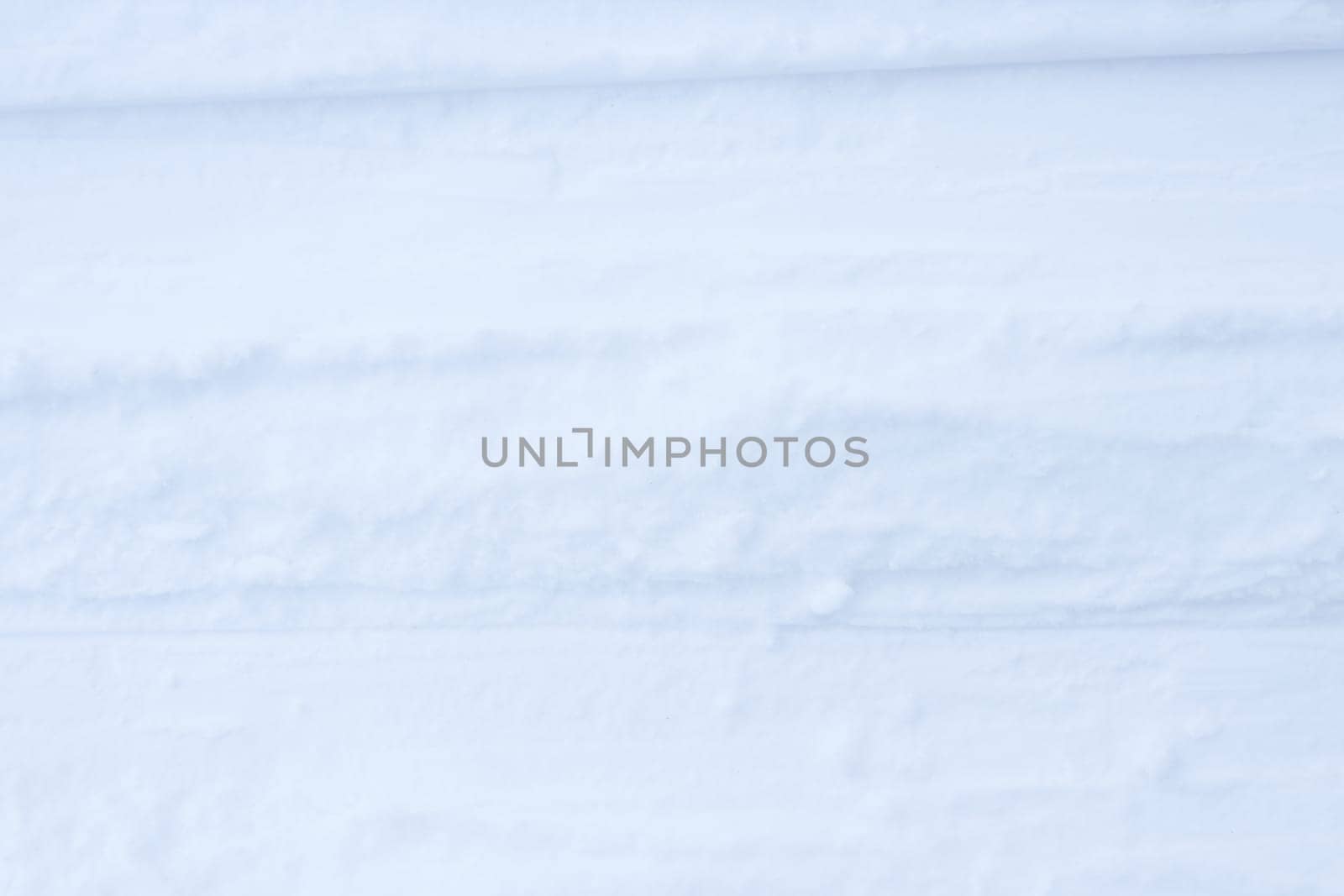 Ski run traces background. Snow skiing track surface. Ski trail texture.