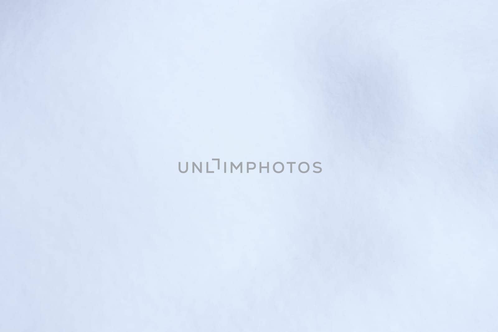 Soft snow hills surface. Snowy mound texture. Winter snowdrift landscape background.