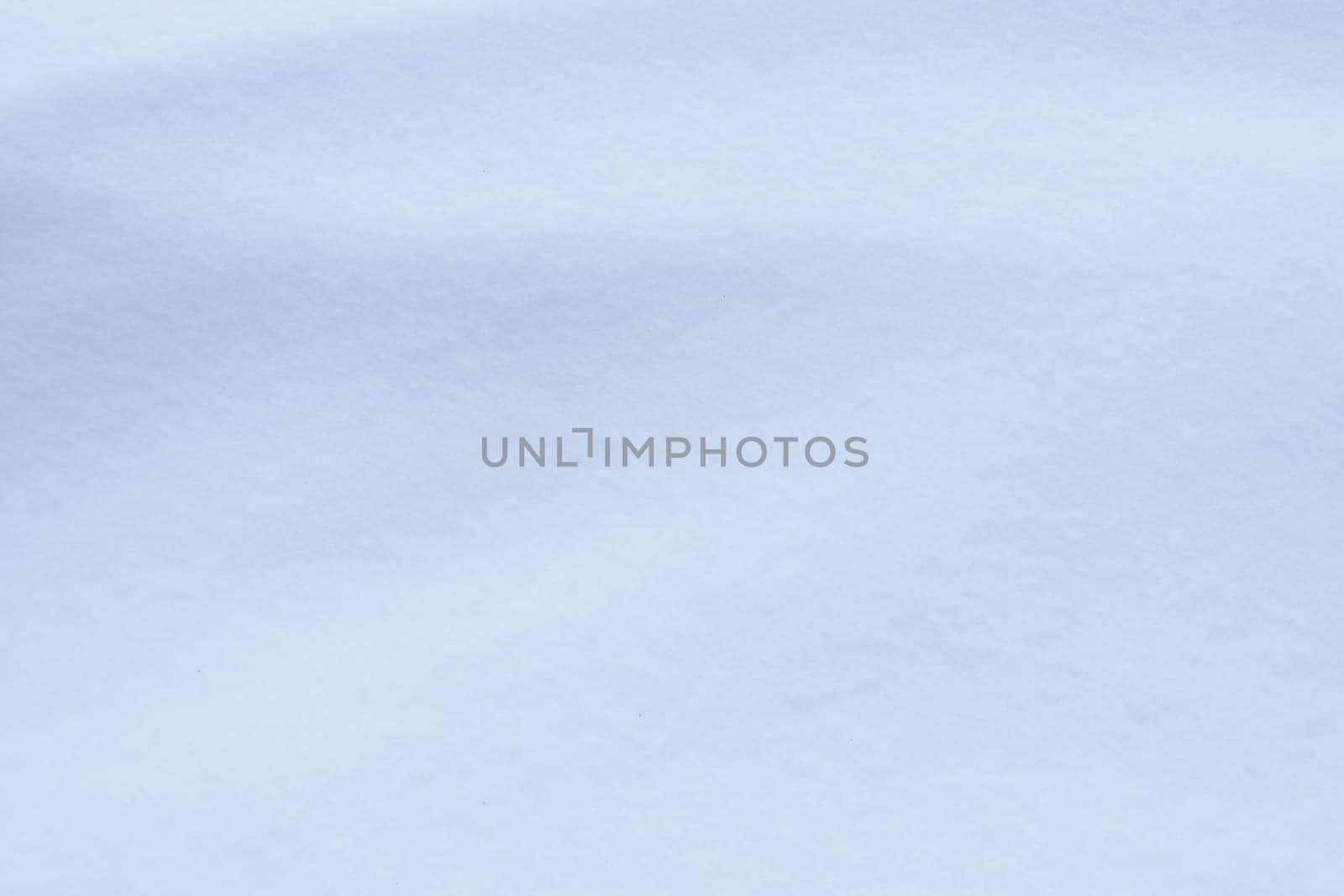 Winter snowdrift landscape background. Soft snow hills surface. Snowy mound texture.