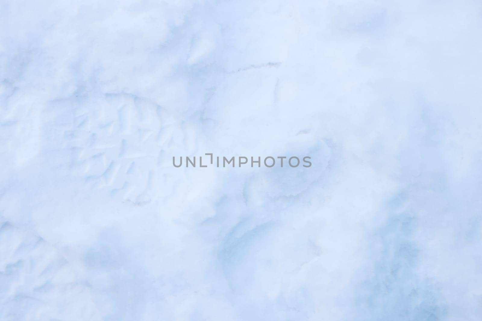 Snow boots tracks surface. Ski boots texture. Shoe sole traces background.