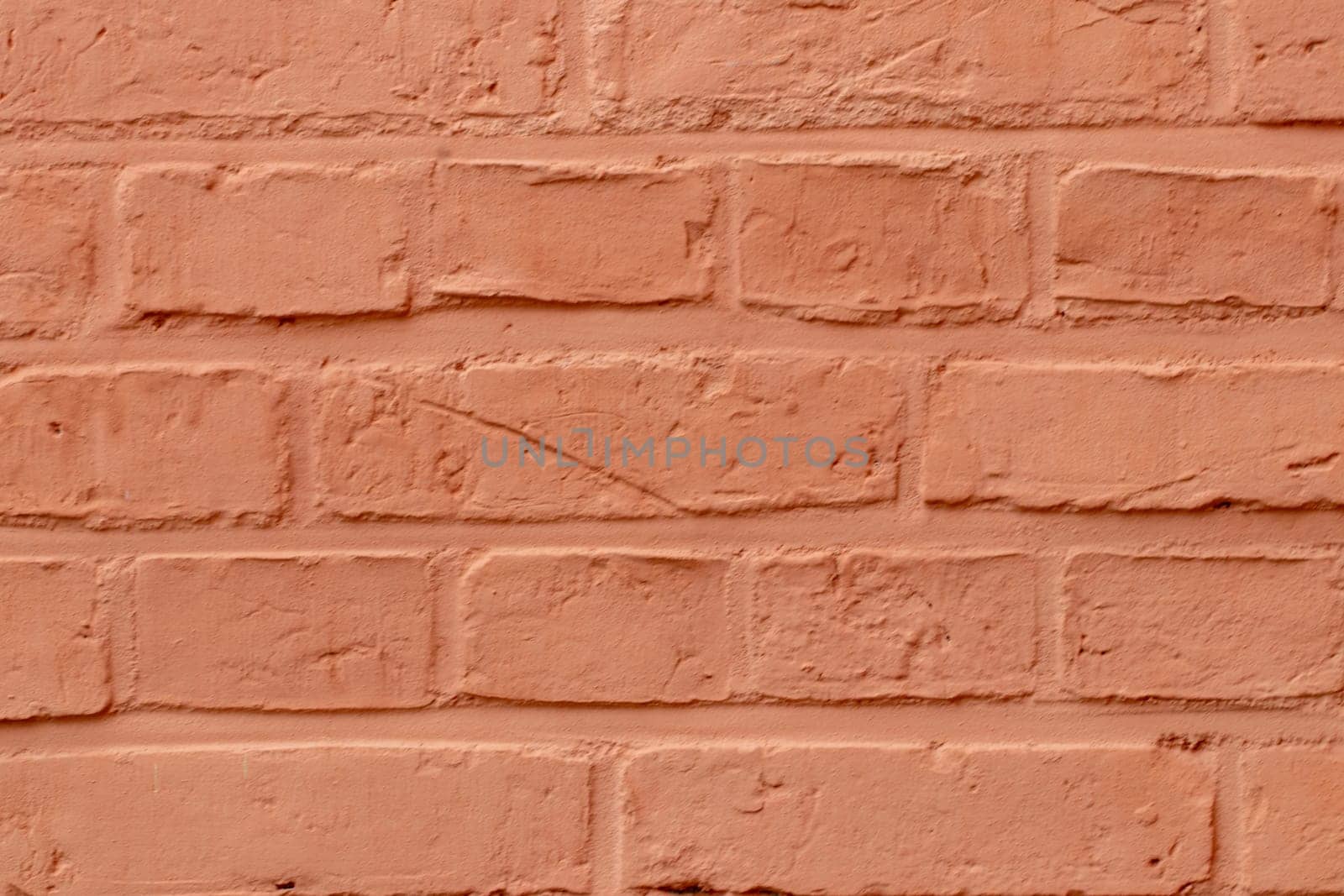 Stone texture background. Closeup of a orange brick wall texture. Abstract brick stones pattern background concept, retro layout, interior design and wall banner. Macro photograph.