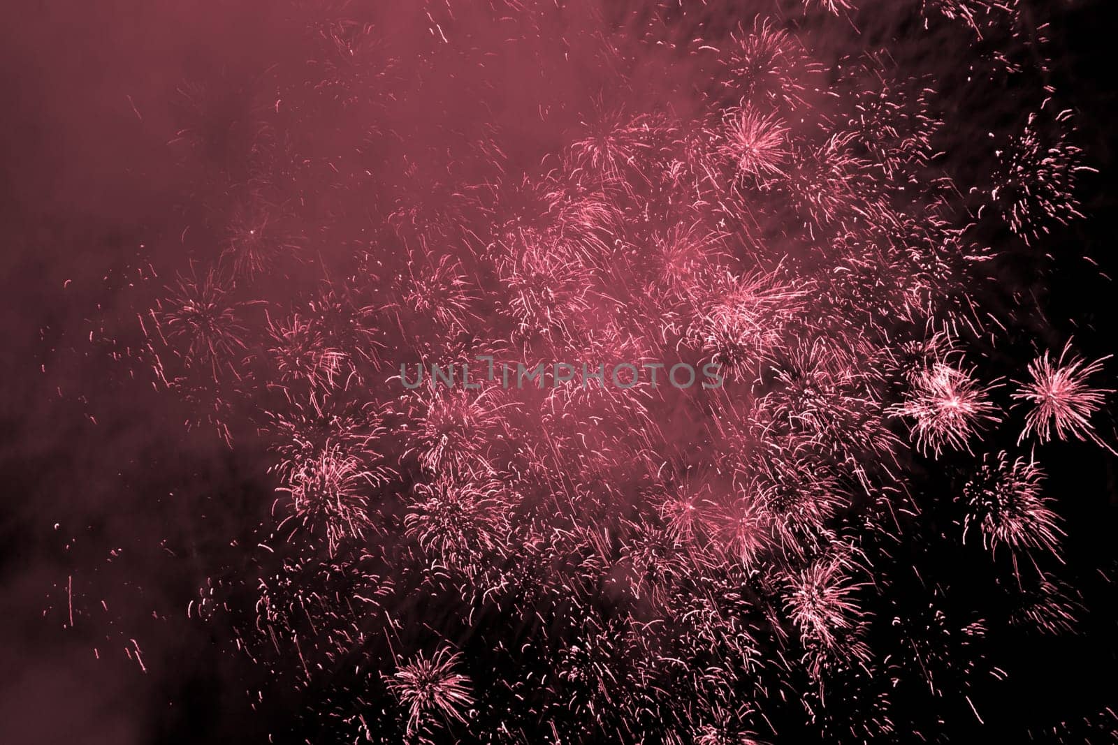 Premium entertainment magic star firework at e.g. New Years Eve or Independence Day party celebration. Black dark night background.