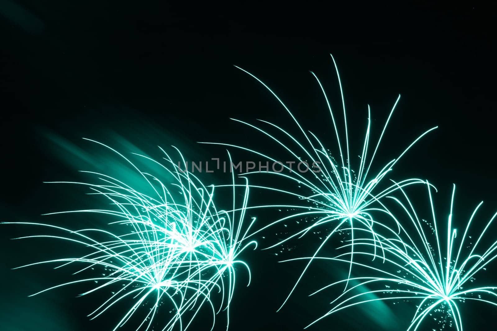 Premium entertainment magic star firework at e.g. New Years Eve or Independence Day party celebration. Black dark night background.