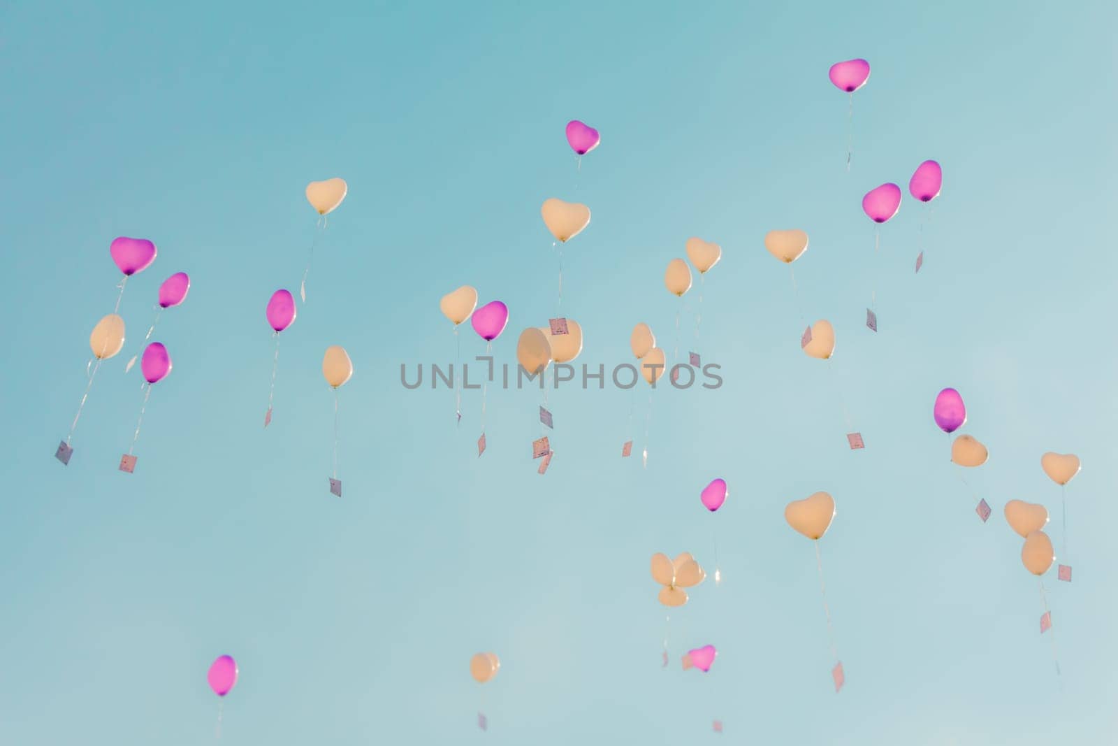 Romantic symbol of future partnership. Group of beautiful heart ballons with congratulations cards at wedding party or valentines day.