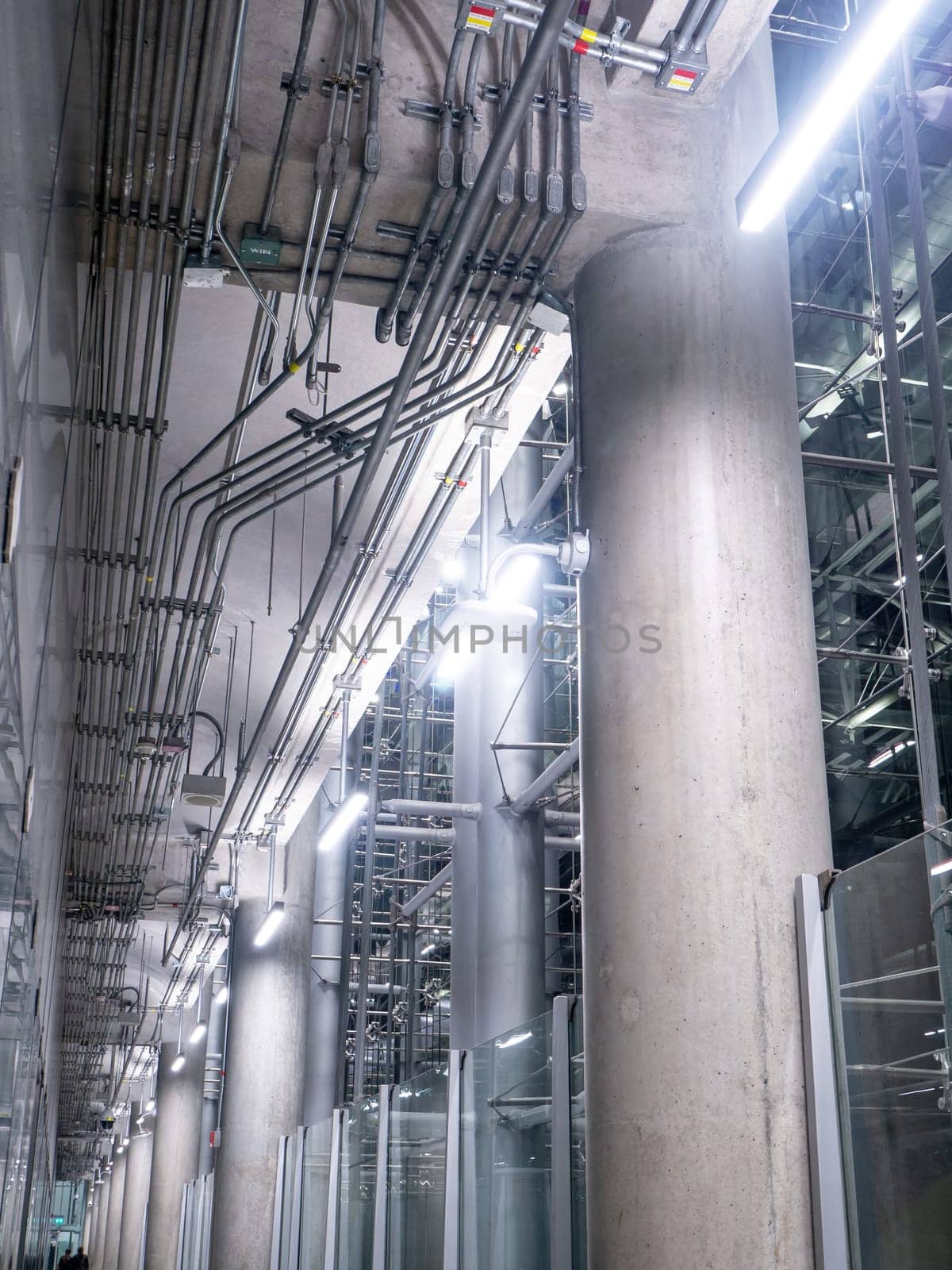 big windows passing daylight inside office building on modern glass building interior corridor