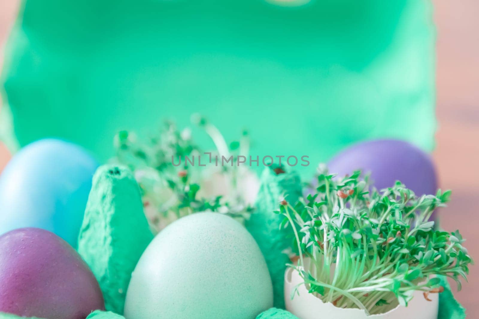 Beautiful decoration easternest basket with painted eggshells for celebration. Lovely traditional gift design on wooden background.