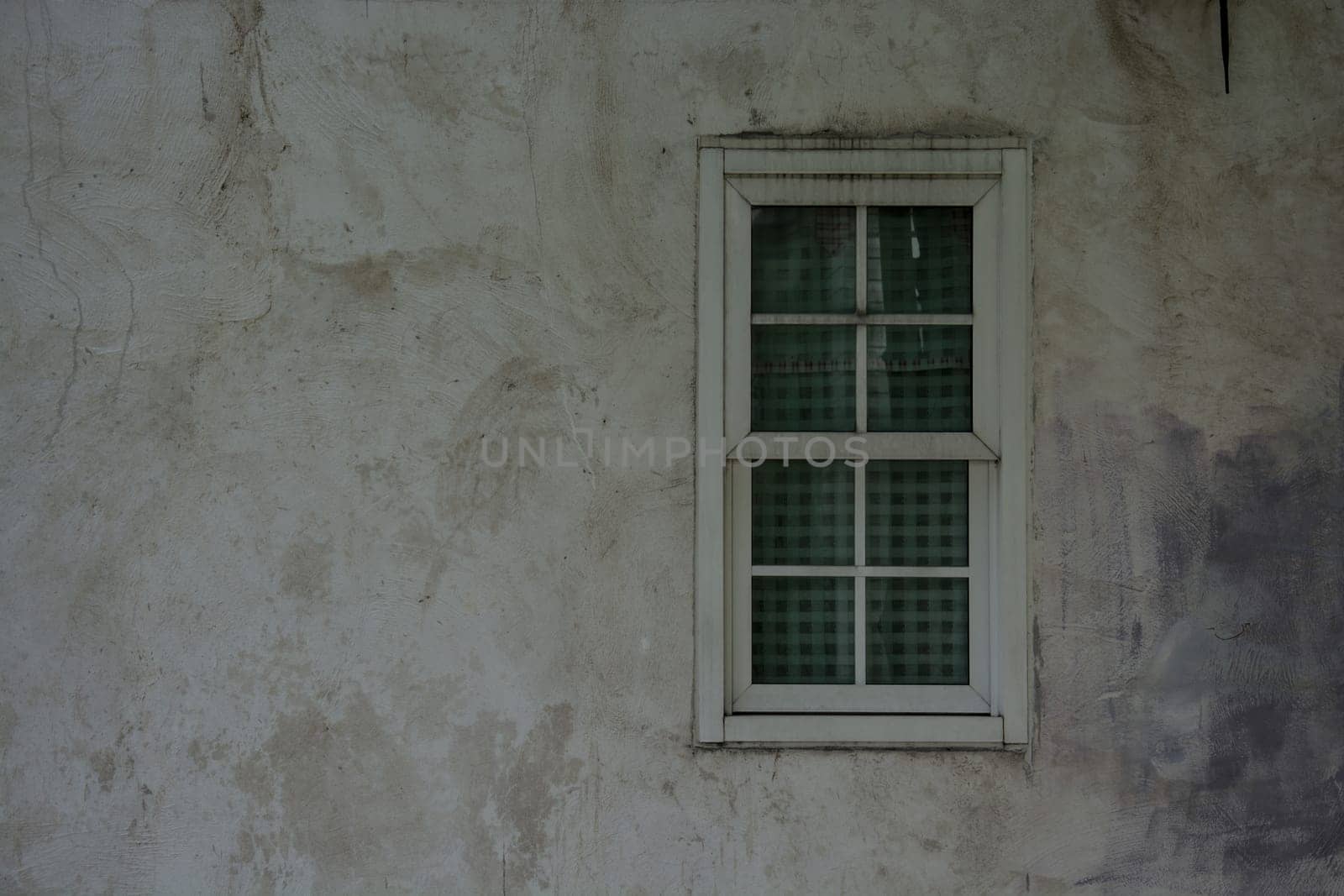Vintage window on nice color cement wall can be used for background
