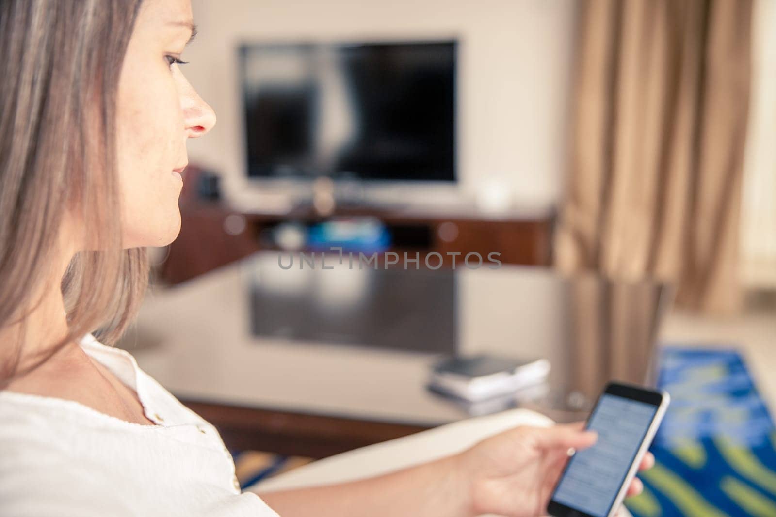 mature woman is waiting for her phone to ring