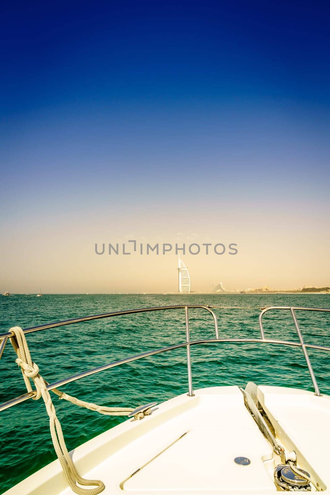 View of Dubai coast from the bow of a yacht