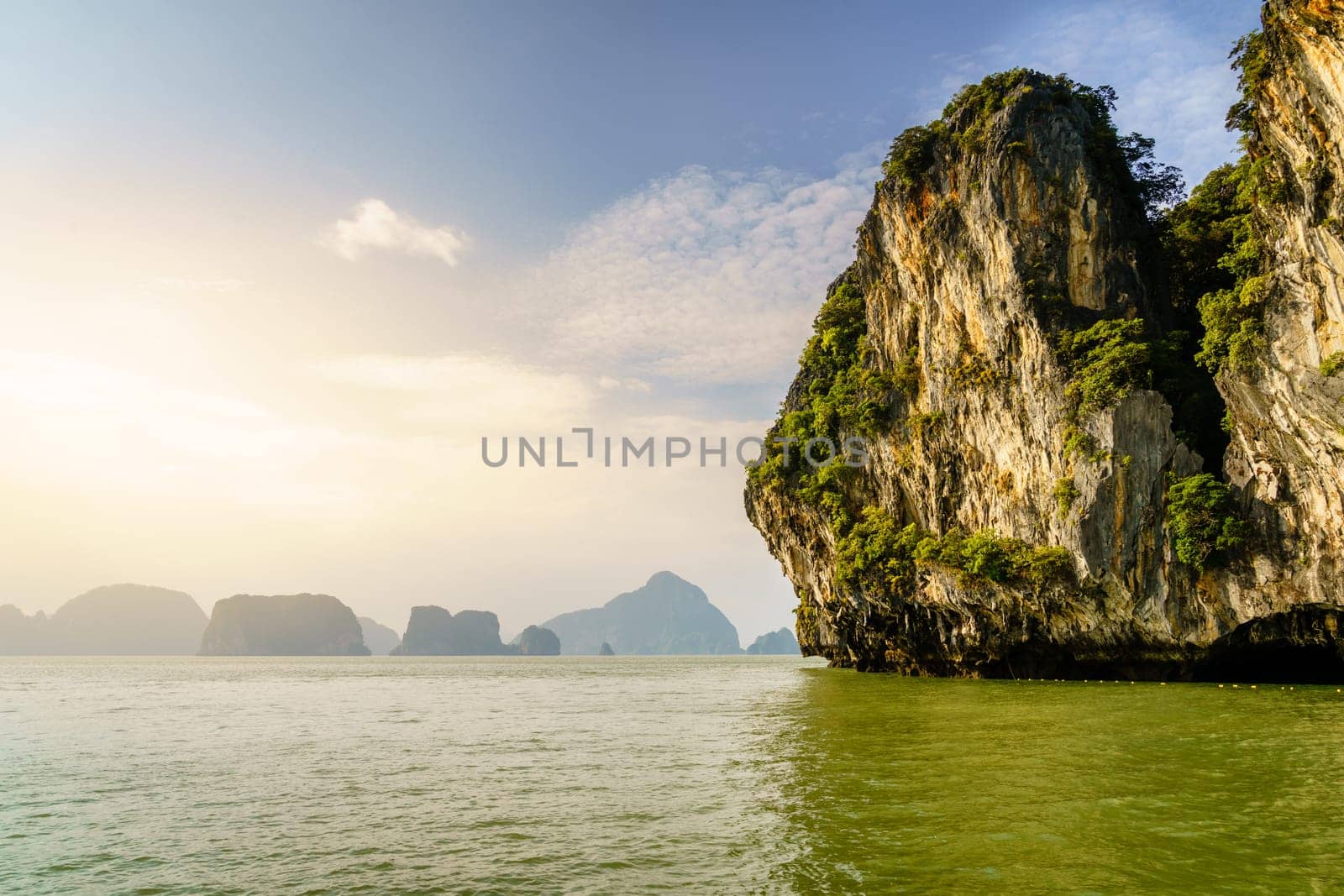 View of Koh Hong island in Andaman Sea with Phuket coastline on the horizon