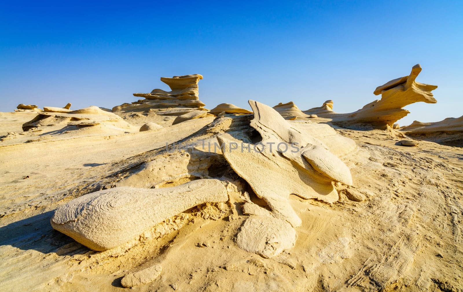 Sandstone formations in Abu Dhabi desert in United Arab Emirates