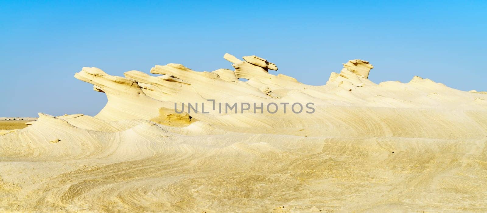 Sandstone formations in Abu Dhabi desert in United Arab Emirates