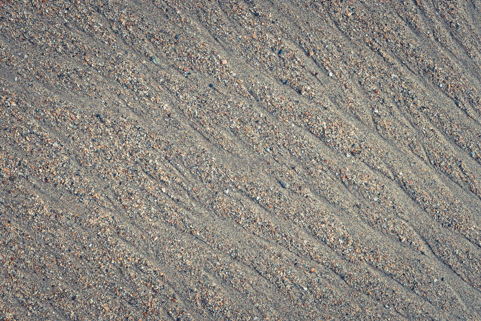 Wet sand water stock texture. Summer beach background.