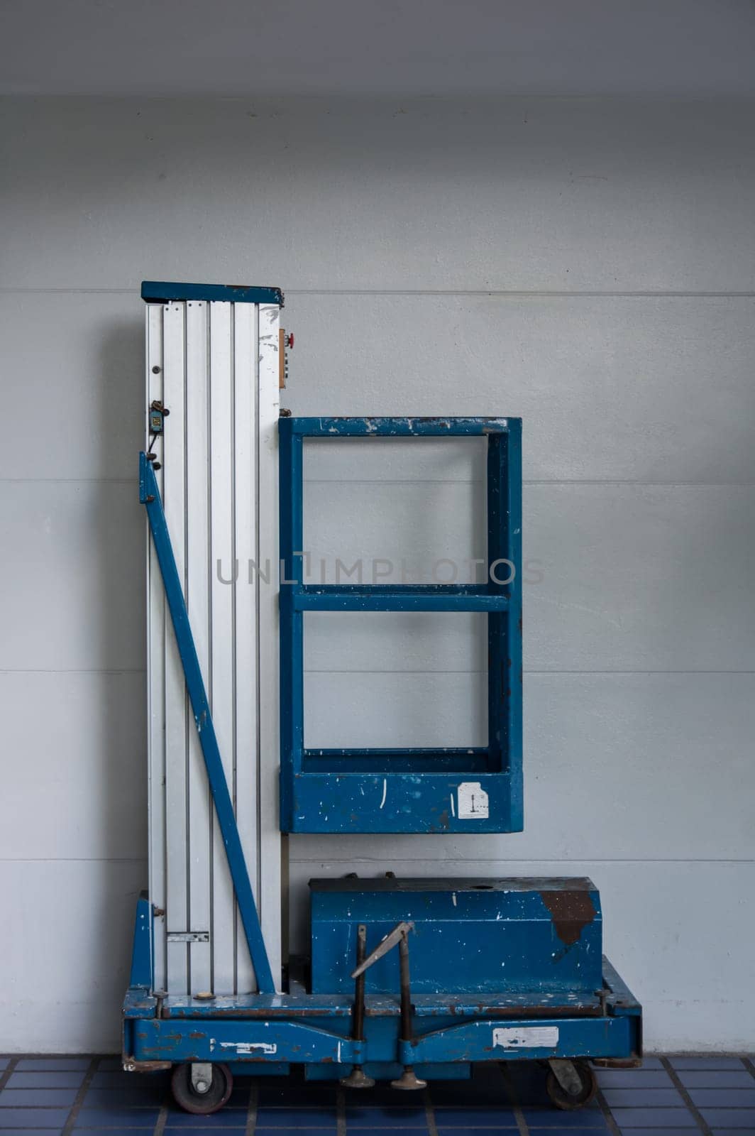 distribution warehouse hall with hydraulic scissors lift platform