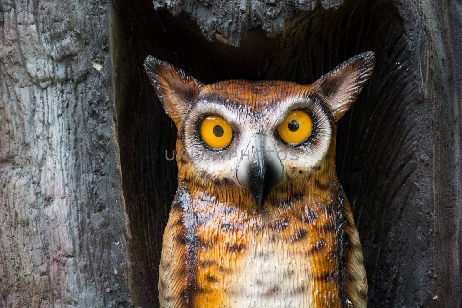 Wooden Owl statue in the tree