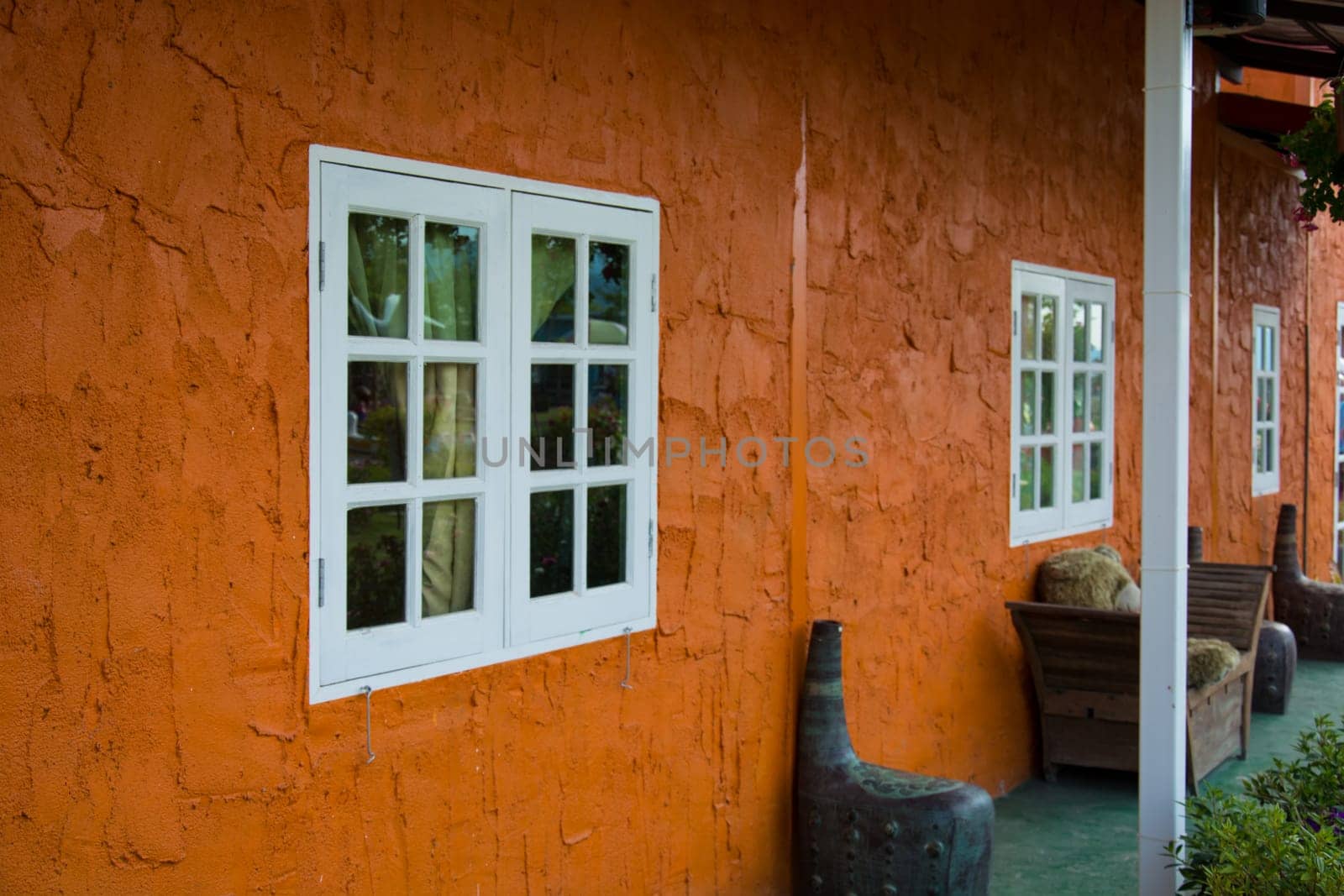 Window With Flower Basket On Orange Wall