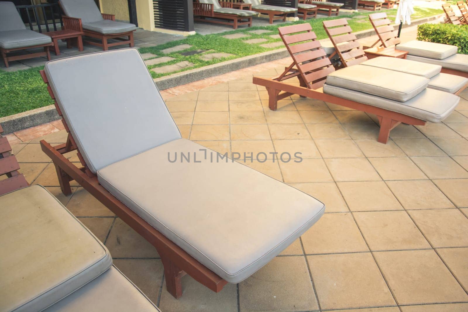 Chairs on a pool deck in hotel
