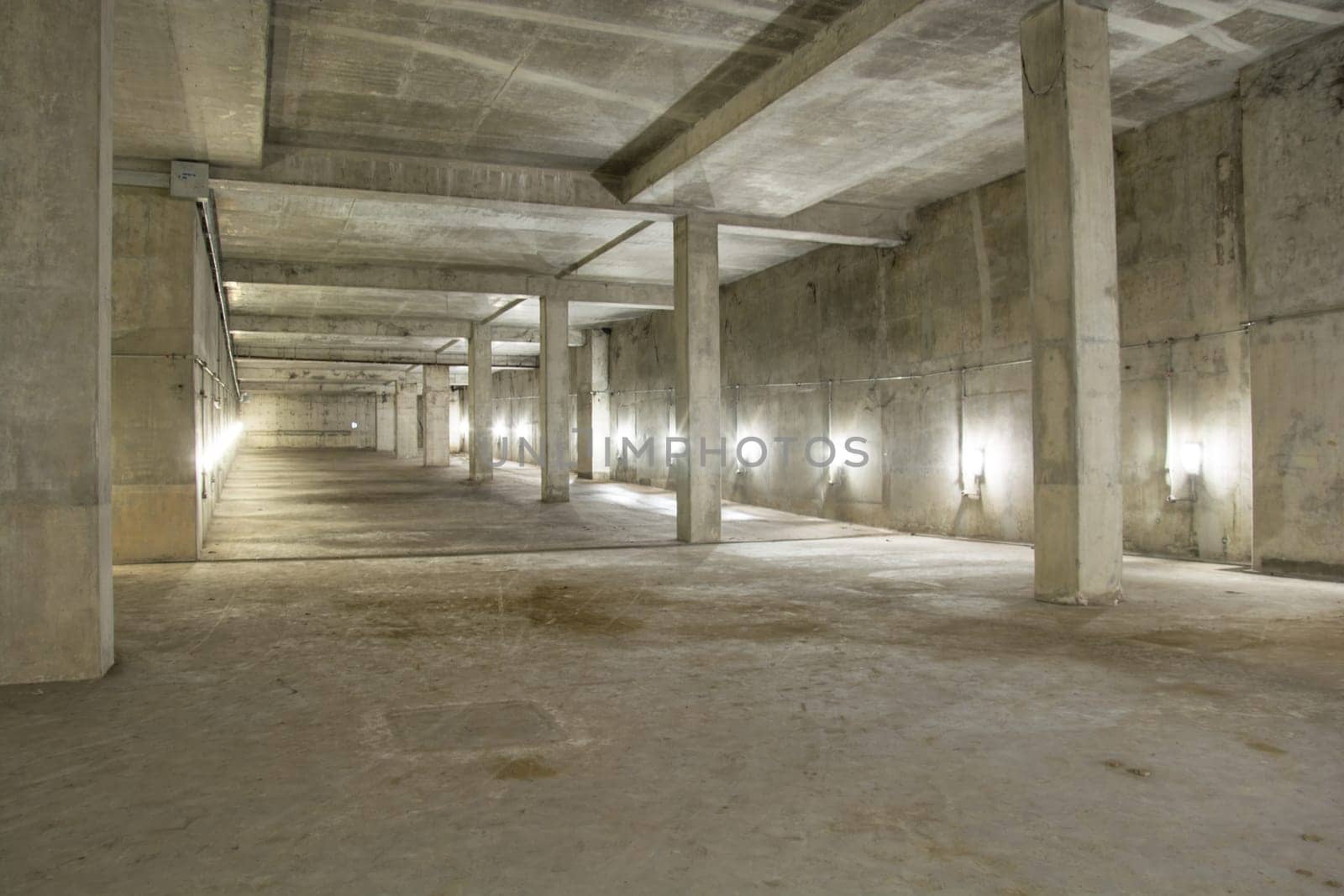 Empty industrial garage room interior with concrete floor and wall background