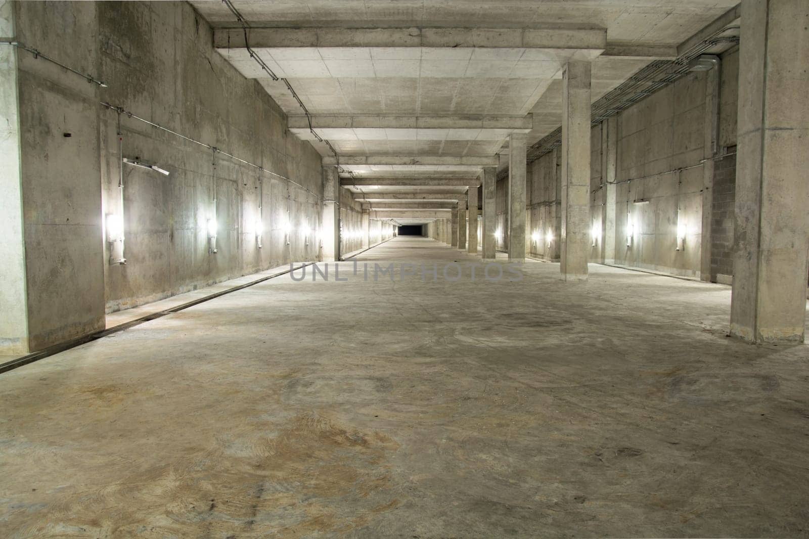 Empty industrial garage room interior with concrete floor and wall background