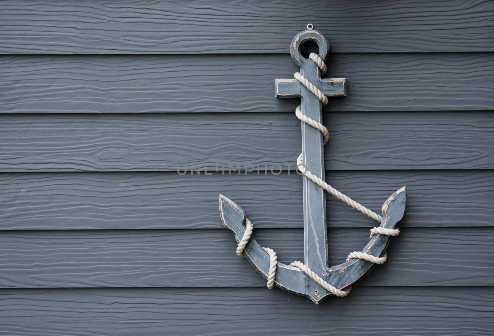 wooden anchor on wall vintage background