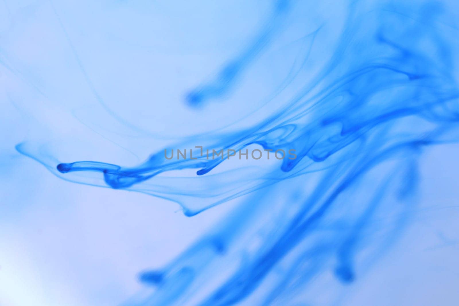 Soft Ink Drips Dynamic in Water. Abstract Background.