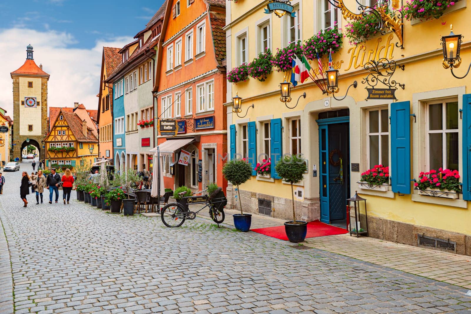 Rothenburg Ob Der Tauber, Germany - SEPTEMBER 24, 2014: View on old city street with traditional architecture of Rothenburg Ob Der Tauber, Bavaria, Germany, Europe