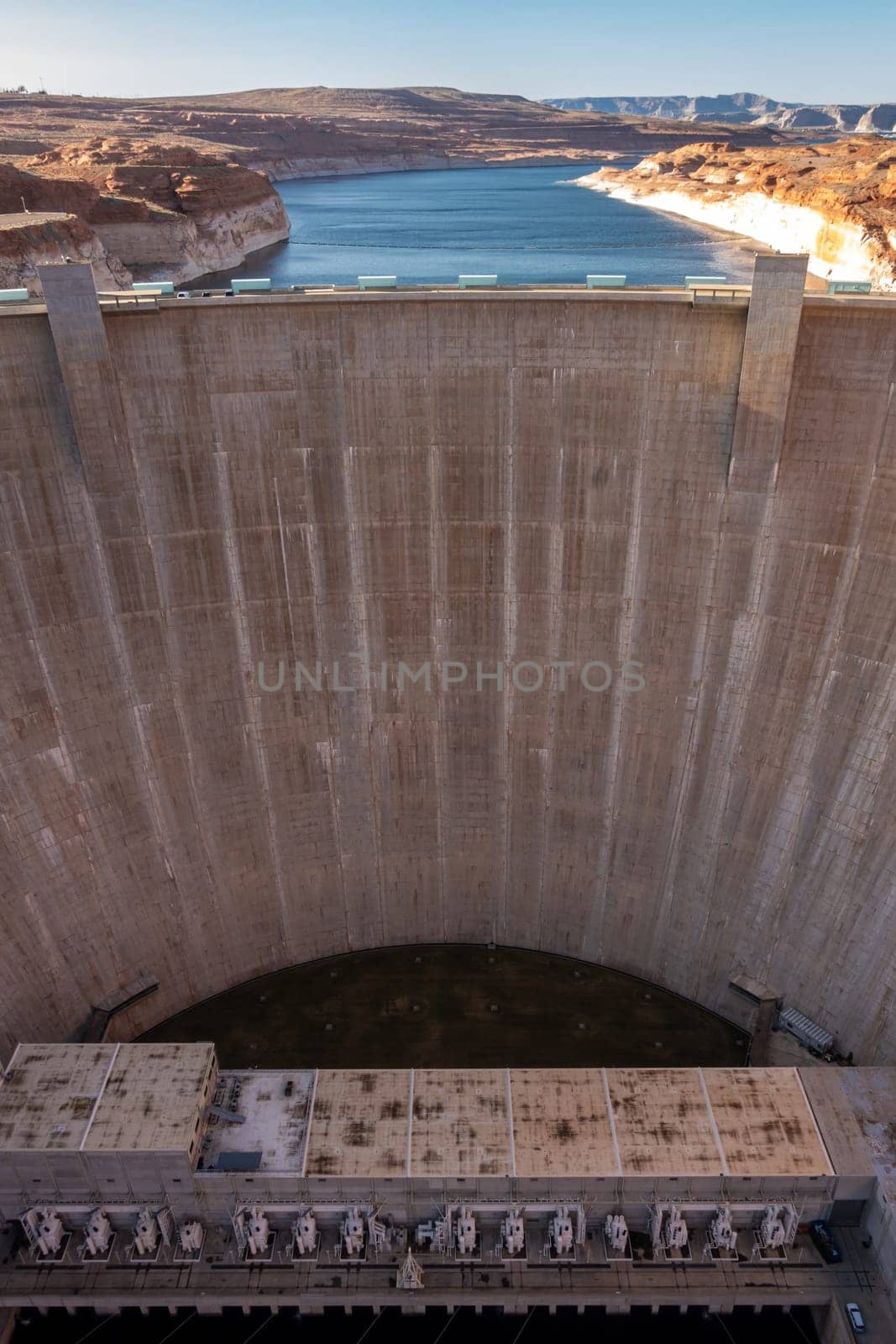 Glen Canyon Dam with Lake Powell in the Desert rural area of Page city Arizona, United States. USA Landmark environmental water resources reservoir and electricity concept.