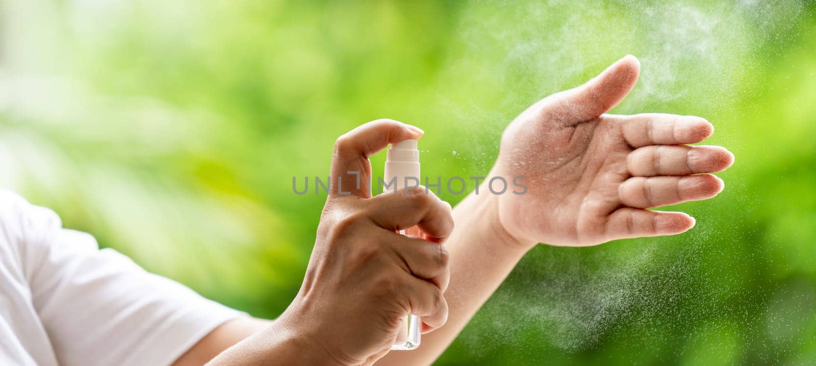 Panoramic web banner cleaning hand by alocohol spray Hand sanitazer from bottle spraying, disinfection safety prevent and protect from infection of virus and germ Covid-19 coronavirus world pandemic.