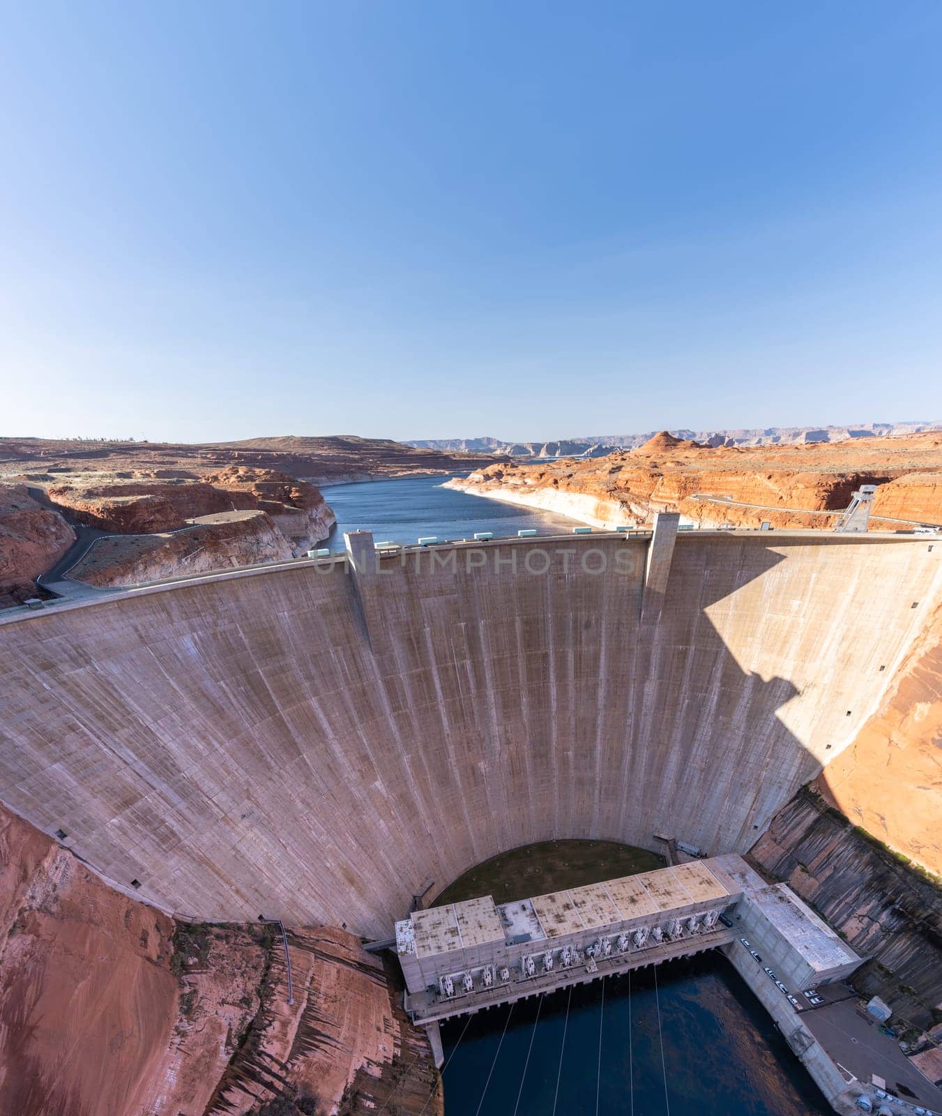 Glen Canyon Dam with Lake Powell in the Desert rural area of Page city Arizona, United States. USA Landmark environmental water resources reservoir and electricity concept.