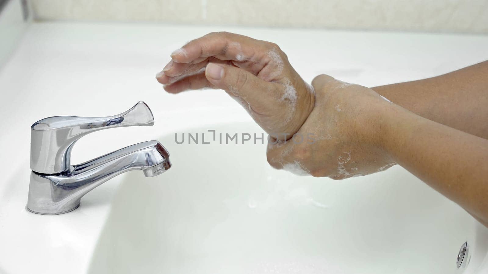 7 steps hand washing - Step 7/7 Rub both weists rotating manner, protection from coronavirus COVID-19 infection