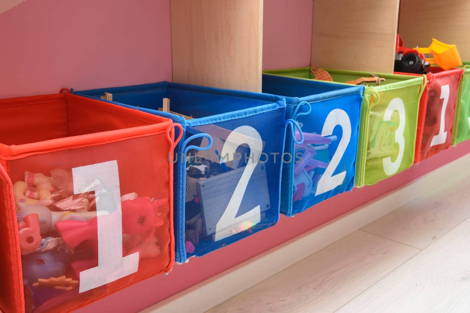 multi-colored boxes with numbers filled with little things