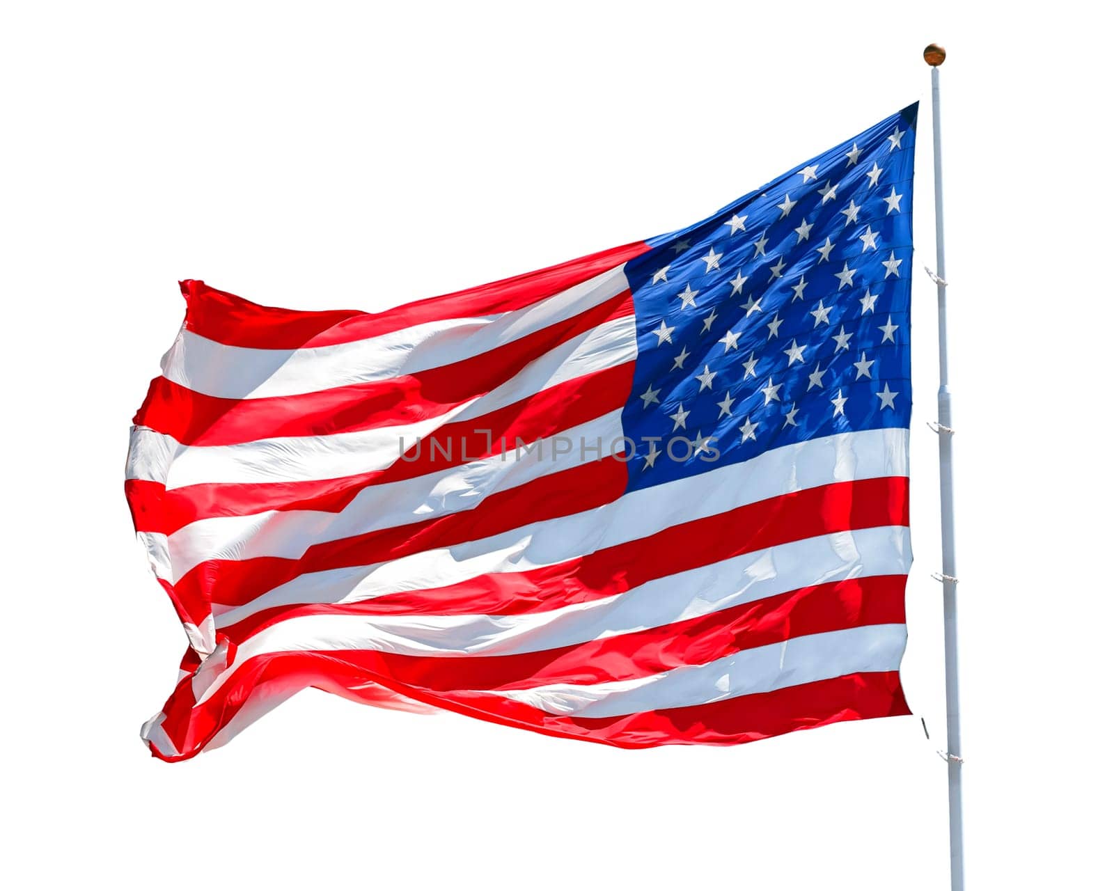 American flag waving in the wind isolated on white background, US flag motion close-up, red white blue flag outdoors in sunlight. United States of America national flag. USA stars and stripes