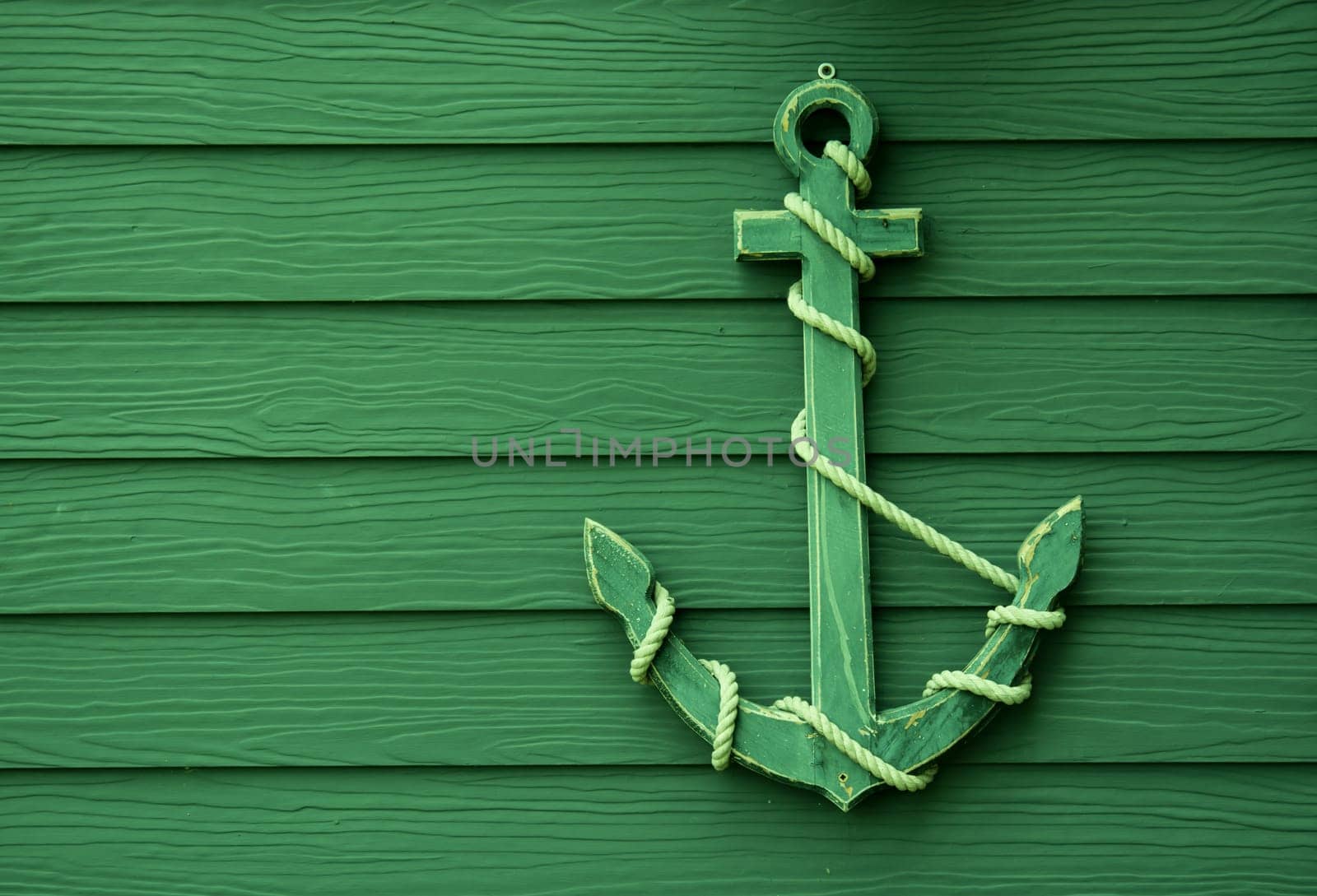 wooden anchor on wall vintage background