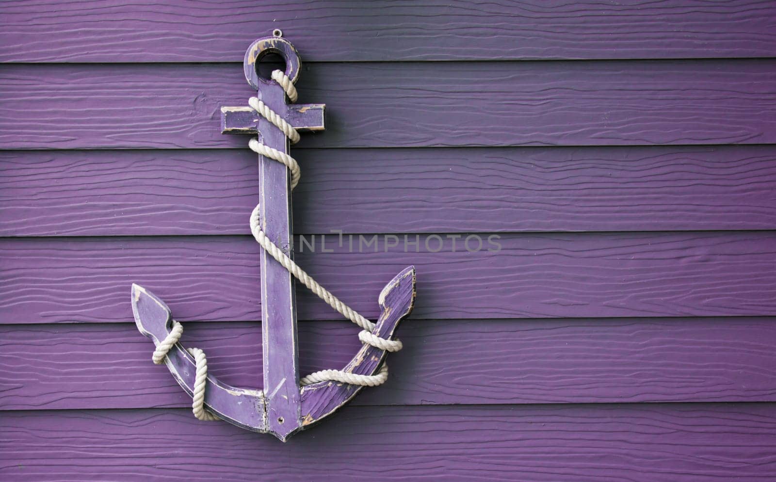 wooden anchor on wall vintage background