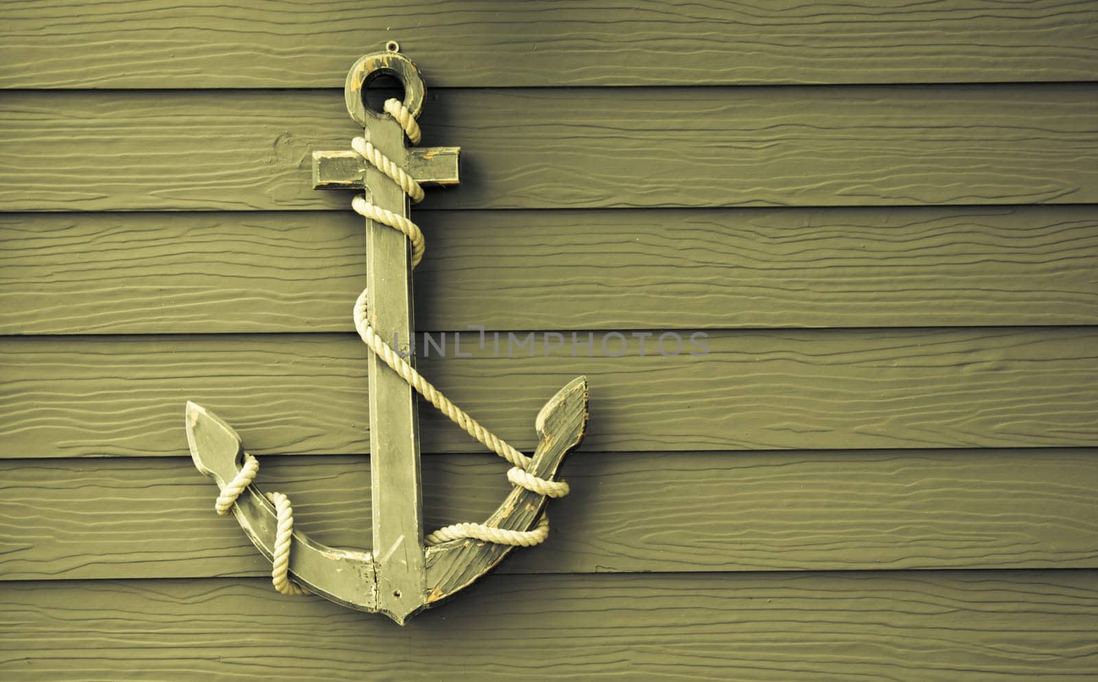 wooden anchor on wall vintage background